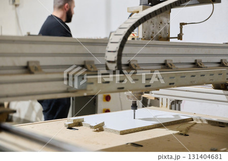 Close-Up of CNC Machine Precisely Cutting and Processing Wooden Boards Close-Up of CNC Machine Precisely Cutting and Processing Wooden Boards 131404681