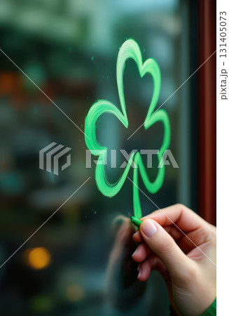Hand drawing green shamrock on glass for st. patrick's day celebration. AI generation 131405073