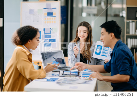 Team business people meeting in office. Employee brainstorm and work plan and discuss project by point on paper and tablet. Team business people meeting in office. Employee brainstorm and work plan and discuss project by point on paper and tablet. 131406251