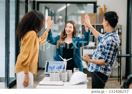 Business team discussing about windmill and alternative green enery. Executive meeting at modern office 131406257