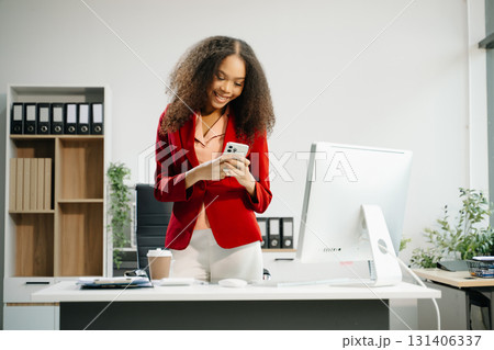 Confident business expert attractive smiling young woman holding digital tablet on desk in creative office. Confident business expert attractive smiling young woman holding digital tablet on desk in creative office. 131406337