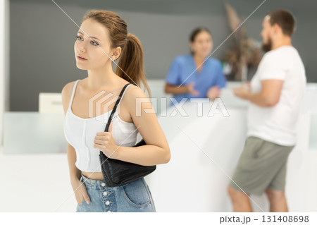 Young woman standing in dental clinic Young woman standing in dental clinic 131408698