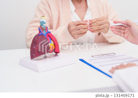 Doctor with Respiratory system. Elderly Patient consultation medical health for Lung Cancer, Asthma, Chronic Obstructive Pulmonary, Bronchitis, Emphysema, Cystic Fibrosis, Bronchiectasis, Pneumonia Doctor with Respiratory system. Elderly Patient consultation medical health for Lung Cancer, Asthma, Chronic Obstructive Pulmonary, Bronchitis, Emphysema, Cystic Fibrosis, Bronchiectasis, Pneumonia 131409171