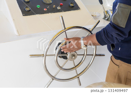 Nautical adventure with steering wheel and control panel for marine navigation 131409497