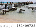 Seaside pier and tables on a sunny day at the beach 131409728