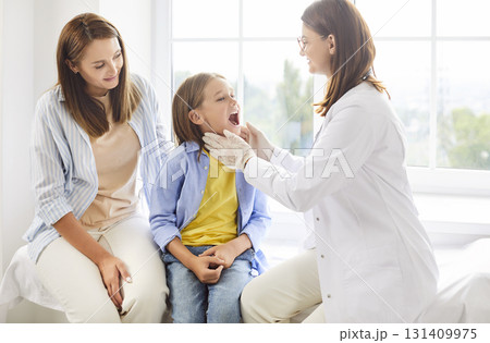 Mother And Child At Dentist Or Nurse Checkup In Clinic Mother And Child At Dentist Or Nurse Checkup In Clinic 131409975