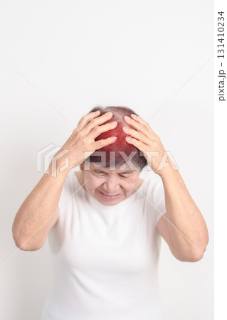 Elderly Woman having headache and Dizzy for concepts of Chronic Stress, Headache and Migraine, World Brain Tumor day, Brain Cancer, Brain Stroke, Dementia, alzheimer, Hypotension and mental health 131410234