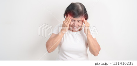 Elderly Woman having headache and Dizzy for concepts of Chronic Stress, Headache and Migraine, World Brain Tumor day, Brain Cancer, Brain Stroke, Dementia, alzheimer, Hypotension and mental health 131410235