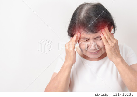 Elderly Woman having headache and Dizzy for concepts of Chronic Stress, Headache and Migraine, World Brain Tumor day, Brain Cancer, Brain Stroke, Dementia, alzheimer, Hypotension and mental health 131410236
