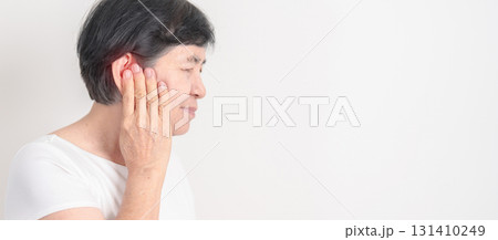 Elderly Woman having Ear pain for concept of Ear disease, Atresia, Otitis Media, Infection, Pertorated Eardrum, Meniere syndrome, Otolaryngologist, Hearing Loss, Hyperacusis, Tinnitus and Earwax 131410249
