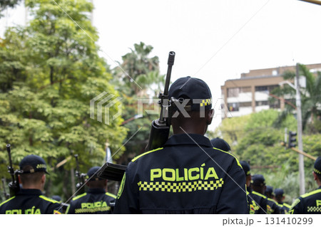 Armed police with long range weapons, Law enforcement officers carrying rifles, Colombian police with heavy firearms Armed police with long range weapons, Law enforcement officers carrying rifles, Colombian police with heavy firearms 131410299