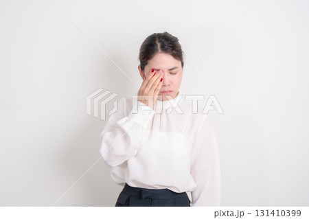 Business Woman having Eye pain and Irritation for concepts of Eye disease, Cataract, Glaucoma, Age Related Macular Degeneration, Diabetic Retinopathy, dry eyes, Conjunctivitis, World Glaucoma day 131410399