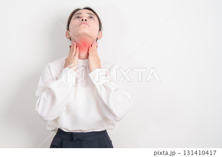 business Woman checking Thyroid gland disease. Hand holding Neck pain and Sore Throat. Hyperthyroidism, Hypothyroidism, Hashimoto Thyroiditis, Thyroid Tumor and Cancer, Postpartum, Papillary Carcinoma 131410417