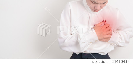 Business Woman having chest pain for Heart disease, angina disease and symptom heart attack disease Cardiovascular, Atherosclerosis, Hypertensive, Breast Cancer awareness, world Heart day and Health 131410435
