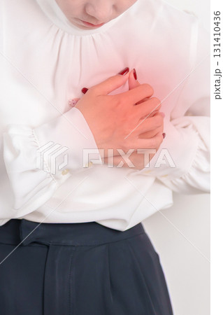 Business Woman having chest pain for Heart disease, angina disease and symptom heart attack disease Cardiovascular, Atherosclerosis, Hypertensive, Breast Cancer awareness, world Heart day and Health 131410436