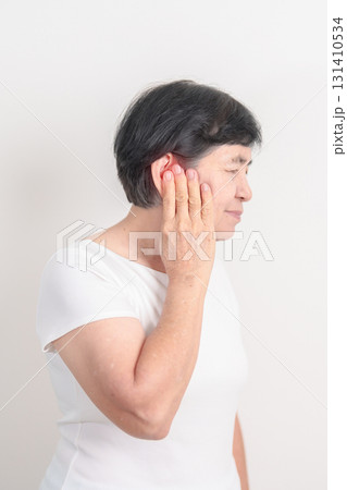 Elderly Woman having Ear pain for concept of Ear disease, Atresia, Otitis Media, Infection, Pertorated Eardrum, Meniere syndrome, Otolaryngologist, Hearing Loss, Hyperacusis, Tinnitus and Earwax 131410534
