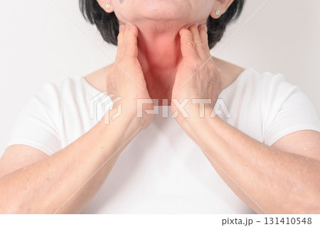 elderly Woman checking Thyroid gland disease. Hand holding Neck pain and Sore Throat. Hyperthyroidism, Hypothyroidism, Hashimoto Thyroiditis, Thyroid Tumor and Cancer, Postpartum, Papillary Carcinoma 131410548