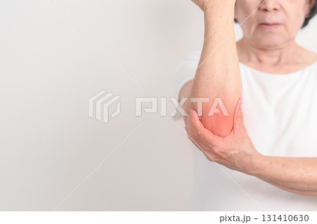 Elderly Woman having elbow ache for concepts of Tennis Elbow, muscle pain, lateral epicondylitis, Bursitis, injury, Office syndrome, Senior Health care and medical 131410630