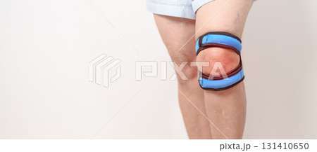 Elderly woman having knee ache with knee support brace for concepts of Runners Knee or Patellofemoral Pain Syndrome, osteoarthritis, arthritis, rheumatism and Patellar Tendinitis. Senior health care Elderly woman having knee ache with knee support brace for concepts of Runners Knee or Patellofemoral Pain Syndrome, osteoarthritis, arthritis, rheumatism and Patellar Tendinitis. Senior health care 131410650