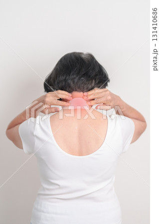 Elderly Woman having Neck pain with Medicated pain relief patch plaster for Neck Muscle Strain and Inflammation, Myofascial pain syndrome and Fibromyalgia, Rheumatism and Cervical Spine Spondylosis 131410686