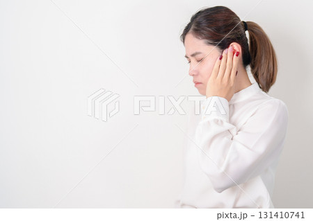 Business Woman having Ear pain for concept of Ear disease, Atresia, Otitis Media, Infection, Pertorated Eardrum, Meniere syndrome, Otolaryngologist, Hearing Loss, Hyperacusis, Tinnitus and Earwax 131410741
