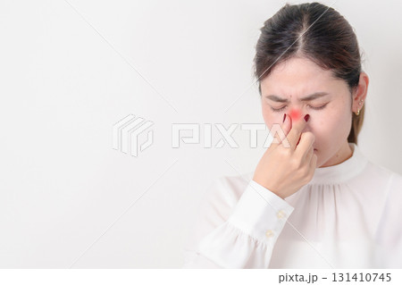 Business Woman having Nose pain for concepts of Nose disease, Common Cold, Influenza, Flu, Covid 19, Respiratory Infection, Sinusitis, Allergic Rhinitis, Asthma, Allergy, Dry nose Anosmia and Health 131410745