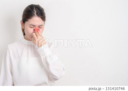 Business Woman having Nose pain for concepts of Nose disease, Common Cold, Influenza, Flu, Covid 19, Respiratory Infection, Sinusitis, Allergic Rhinitis, Asthma, Allergy, Dry nose Anosmia and Health 131410746