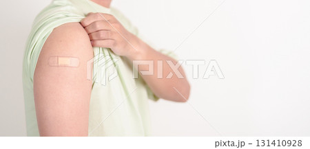 Adult Man with bandage after received vaccine. Vaccination and Immunization for Influenza, HPV, Zoster, IPD, DTP or Diphtheria, Tetanus and Pertussis, MMR, Hepatitis B, Covid and Varicella vaccine 131410928
