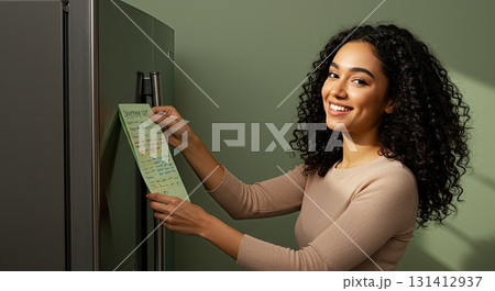 Happy woman shows her schedule, planning week for success. Great planning 131412937