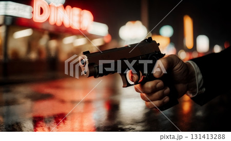 A close-up of a person's hand holding a gun. Gun crime, danger, violence, armed conflict, thriller. 131413288