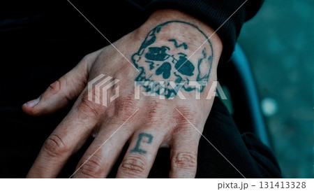 A person's hand with a tattoo. Criminal, gang, tattoos, identity, crime 131413328