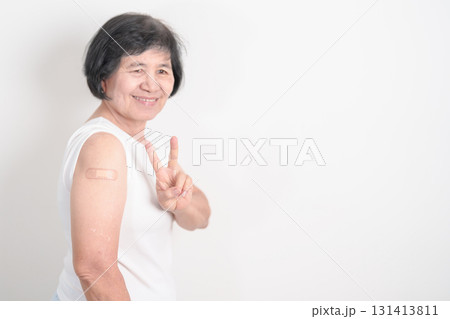 Elderly Woman with bandage after received vaccine. Vaccination and Immunization for Influenza, Herpes Zoster, Tetanus, Covid 19 booster, Dengue, Encephalitis, Rabies, Pneumococcal, IPD, RSV Vaccines Elderly Woman with bandage after received vaccine. Vaccination and Immunization for Influenza, Herpes Zoster, Tetanus, Covid 19 booster, Dengue, Encephalitis, Rabies, Pneumococcal, IPD, RSV Vaccines 131413811