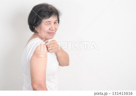 Elderly Woman with bandage after received vaccine. Vaccination and Immunization for Influenza, Herpes Zoster, Tetanus, Covid 19 booster, Dengue, Encephalitis, Rabies, Pneumococcal, IPD, RSV Vaccines Elderly Woman with bandage after received vaccine. Vaccination and Immunization for Influenza, Herpes Zoster, Tetanus, Covid 19 booster, Dengue, Encephalitis, Rabies, Pneumococcal, IPD, RSV Vaccines 131413816