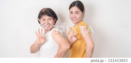 Adult and Elderly Woman with bandage after received vaccine. Vaccination and Immunization for Influenza, HPV, Zoster, IPD, DTP, Dengue, Encephalitis, Rabies, Pneumococcal Hepatitis B and Covid vaccine Adult and Elderly Woman with bandage after received vaccine. Vaccination and Immunization for Influenza, HPV, Zoster, IPD, DTP, Dengue, Encephalitis, Rabies, Pneumococcal Hepatitis B and Covid vaccine 131413853