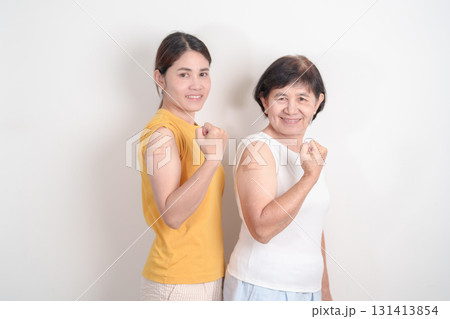 Adult and Elderly Woman with bandage after received vaccine. Vaccination and Immunization for Influenza, HPV, Zoster, IPD, DTP, Dengue, Encephalitis, Rabies, Pneumococcal Hepatitis B and Covid vaccine Adult and Elderly Woman with bandage after received vaccine. Vaccination and Immunization for Influenza, HPV, Zoster, IPD, DTP, Dengue, Encephalitis, Rabies, Pneumococcal Hepatitis B and Covid vaccine 131413854