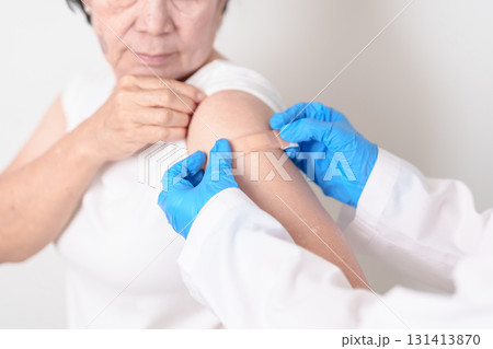 Elderly Woman with bandage after received vaccine. Vaccination and Immunization for Influenza, Herpes Zoster, Tetanus, Covid 19 booster, Dengue, Encephalitis, Rabies, Pneumococcal, IPD, RSV Vaccines Elderly Woman with bandage after received vaccine. Vaccination and Immunization for Influenza, Herpes Zoster, Tetanus, Covid 19 booster, Dengue, Encephalitis, Rabies, Pneumococcal, IPD, RSV Vaccines 131413870