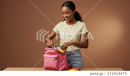 Happy woman's daily preparation, packing healthy lunch. Mindful preparation 131414475