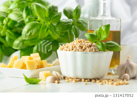 Pesto sauce with ingredients on a white wooden table. Pesto sauce with ingredients on a white wooden table. 131417052