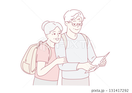 Smiling mature couple look at map traveling 131417292