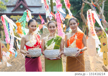 Songkran festival. Portrait Northern Thai people in Traditional clothes dressing handle handcrafted silver bowl in Songkran day summer Thailand cultural festival. Songkran festival. Portrait Northern Thai people in Traditional clothes dressing handle handcrafted silver bowl in Songkran day summer Thailand cultural festival. 131418214