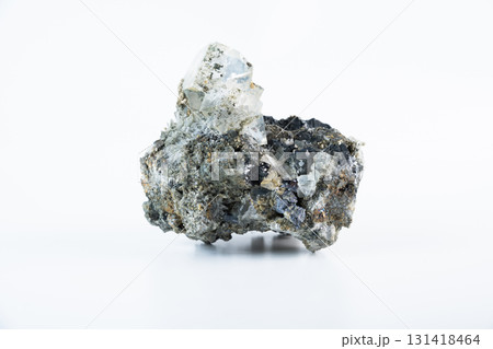 Geological specimen of fluorite with cubic structure, pyrite inclusions, and galena lead glance growth, displayed against a white background. Geological specimen of fluorite with cubic structure, pyrite inclusions, and galena lead glance growth, displayed against a white background. 131418464