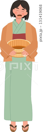 japanese woman in yukata holding wooden bucket after onsen bath at japanese hot spring spa 131419068