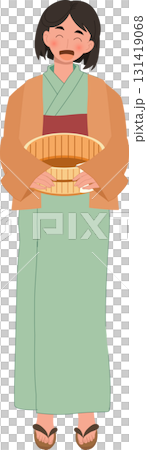 japanese woman in yukata holding wooden bucket after onsen bath at japanese hot spring spa 131419068