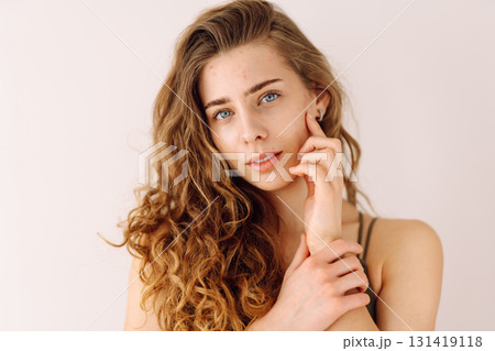 Portrait of a beautiful young woman with inflammations on the skin of her face. Acne disease. 131419118