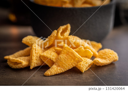 Bugles snack. Cone corn chips on kitchen table. Bugles snack. Cone corn chips on kitchen table. 131420064