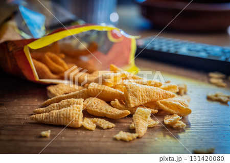 Bugles snack. Cone corn chips on wooden table. Bugles snack. Cone corn chips on wooden table. 131420080