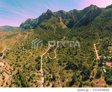 Panoramic view from above of valley and mountain ridge during sunrise. Coves del Canelobre near Busot, Alicante Spain 131420680