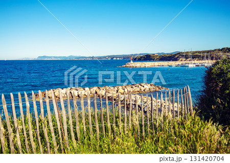 Seascape with wooden fence on a cloudy day. Coudouliere Beach (Six-Fours-les-Plages), France Europe 131420704