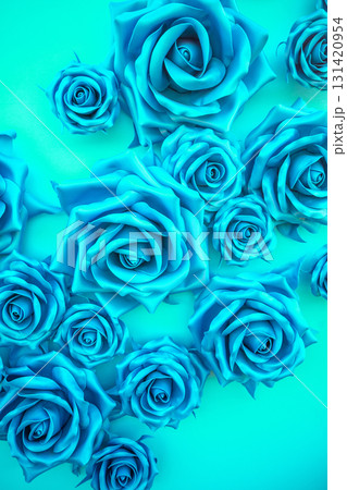 Blue floral background from artificial roses flowers. Vertical photo Blue floral background from artificial roses flowers. Vertical photo 131420954