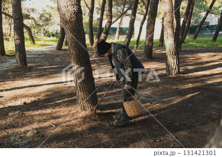 Man In The Forest In Search Of Porcini Mushrooms 131421301